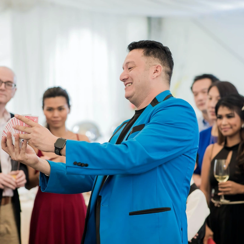 Jose performing close-up magic at a cocktail event